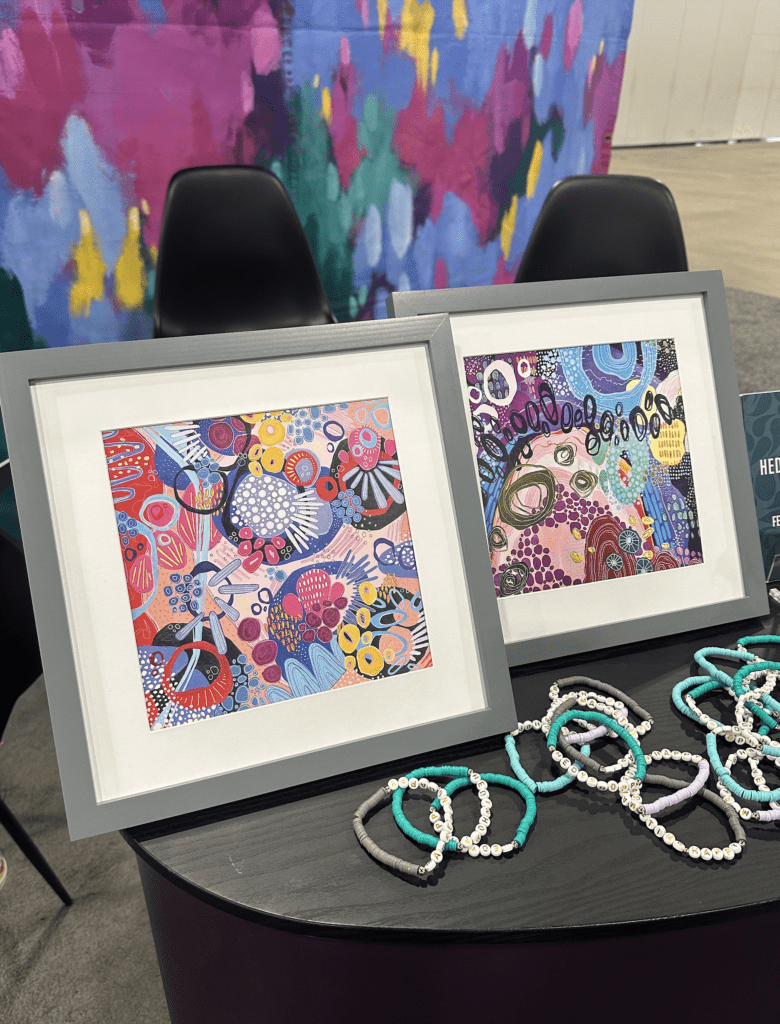 Art prints at Hedy & Hopp's conference booth from artist, Katie Mertz.